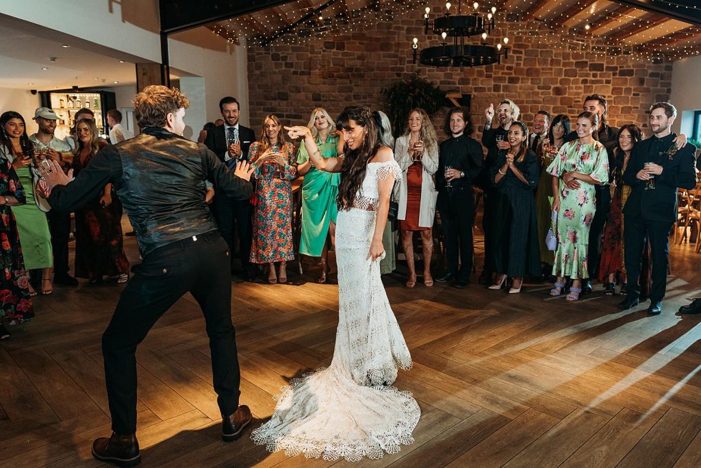 Bride and groom doing an unconventional first dance at Stretton Manor Barn